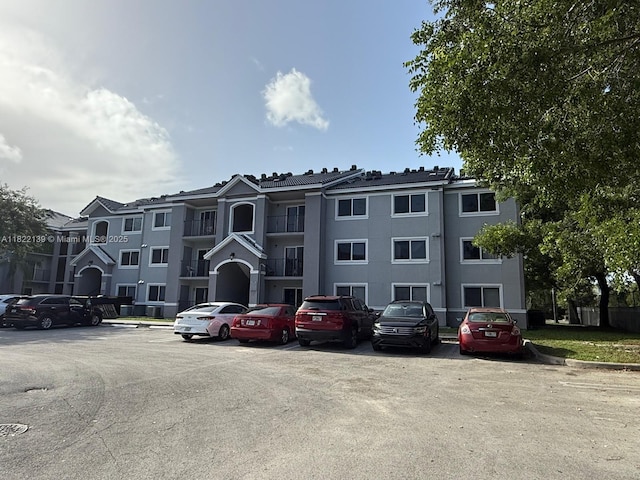 15400 SW 284th St Unit 1308, Homestead, FL 33033 - view of building exterior featuring uncovered parking