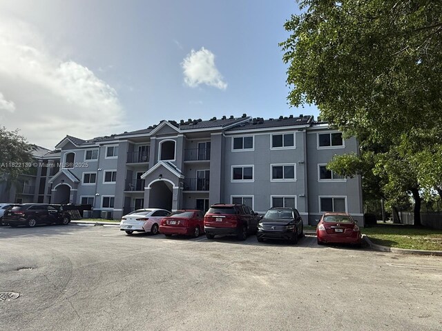 15400 SW 284th St Unit 1308, Homestead, FL 33033 - view of building exterior with uncovered parking