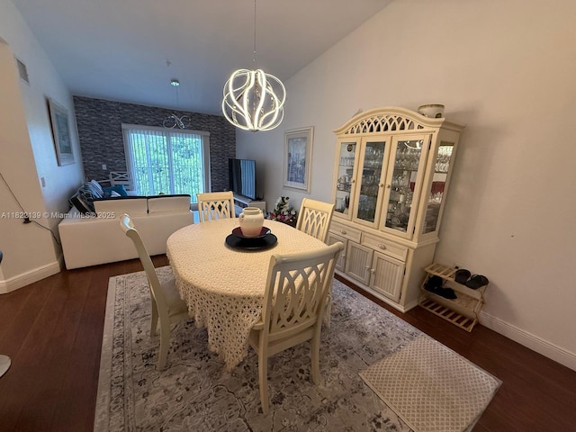 15400 SW 284th St Unit 1308, Homestead, FL 33033 - dining room featuring a chandelier, dark wood finished floors, and vaulted ceiling