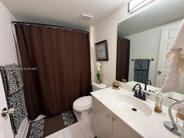 15400 SW 284th St Unit 1308, Homestead, FL 33033 - bathroom featuring a textured wall, vanity, a textured ceiling, tile patterned flooring, and curtained shower