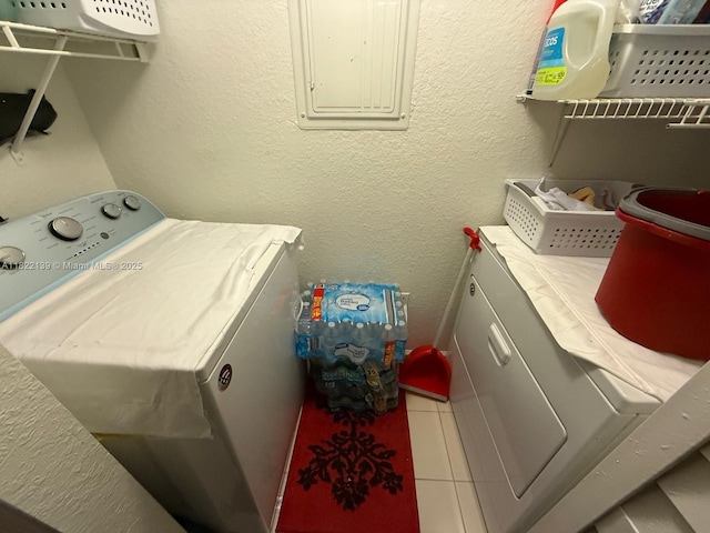 15400 SW 284th St Unit 1308, Homestead, FL 33033 - washroom featuring electric panel, washing machine and clothes dryer, and a textured wall