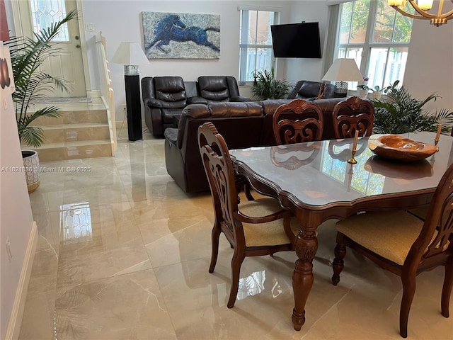 470 NW 102nd Ter, Pembroke Pines, FL 33026 - dining space with light marble finish flooring and a chandelier