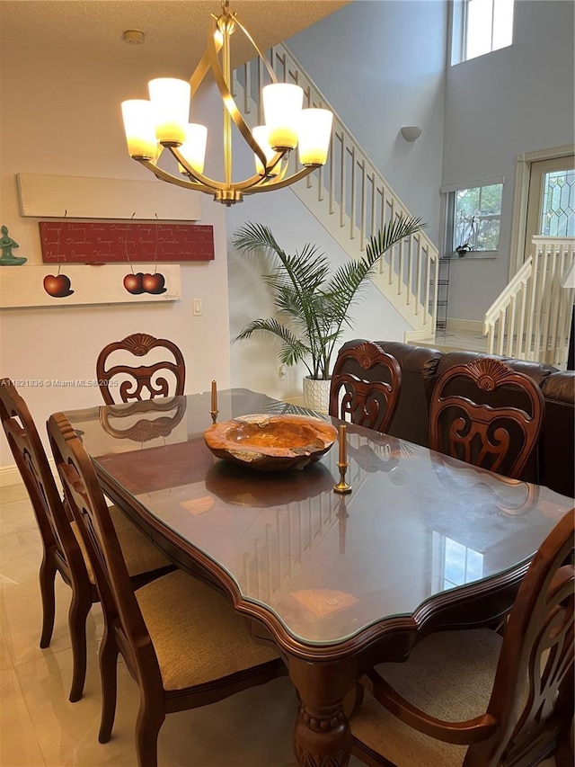470 NW 102nd Ter, Pembroke Pines, FL 33026 - dining area featuring stairway, a chandelier, and a high ceiling