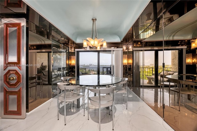 1800 NE 114th St Unit 1103, Miami, FL 33181 - dining space featuring a chandelier and marble tiled flooring