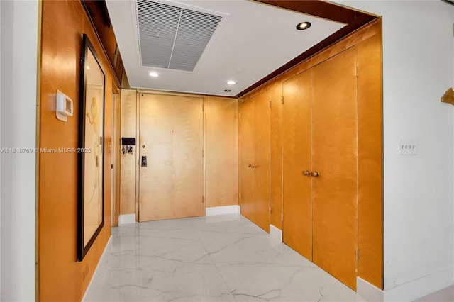 1800 NE 114th St Unit 1103, Miami, FL 33181 - hallway with light marble finish floors and recessed lighting