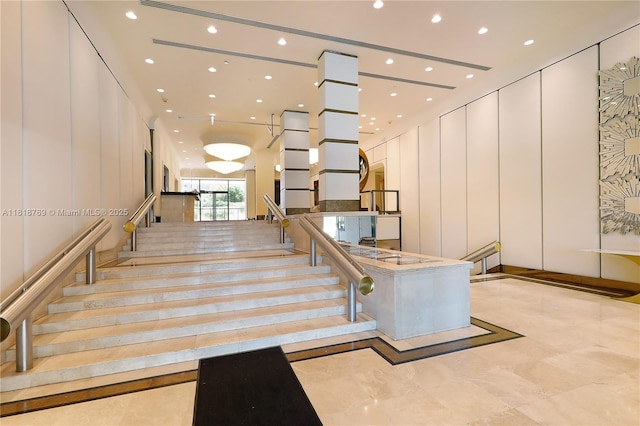 1800 NE 114th St Unit 1103, Miami, FL 33181 - stairs with recessed lighting and a decorative wall