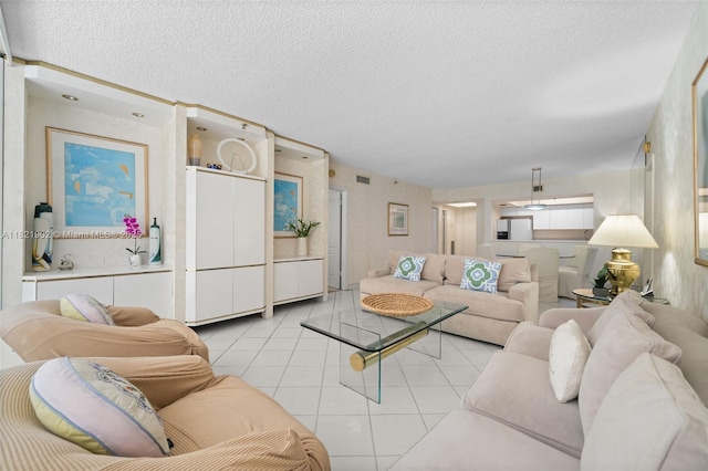 9455 Collins Ave Unit 305, Surfside, FL 33154 - living room with a textured ceiling and light tile patterned flooring