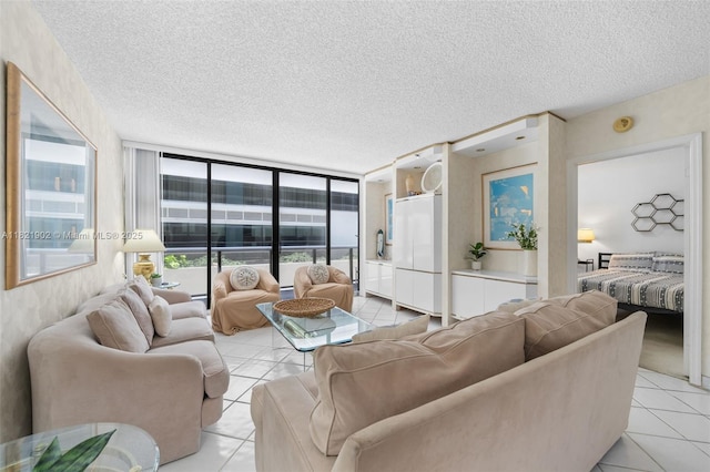 9455 Collins Ave Unit 305, Surfside, FL 33154 - living room with light tile patterned flooring, a textured ceiling, and floor to ceiling windows