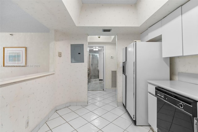 9455 Collins Ave Unit 305, Surfside, FL 33154 - kitchen with dishwasher, electric panel, white cabinetry, light countertops, and freestanding refrigerator