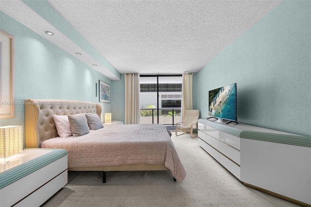 9455 Collins Ave Unit 305, Surfside, FL 33154 - bedroom with carpet floors, expansive windows, and a textured ceiling