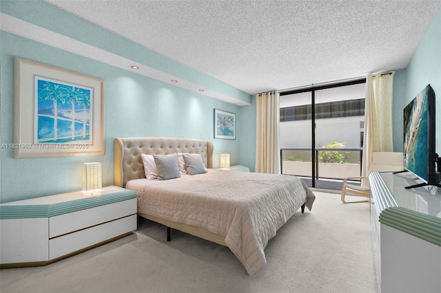 9455 Collins Ave Unit 305, Surfside, FL 33154 - bedroom featuring floor to ceiling windows, carpet flooring, and a textured ceiling