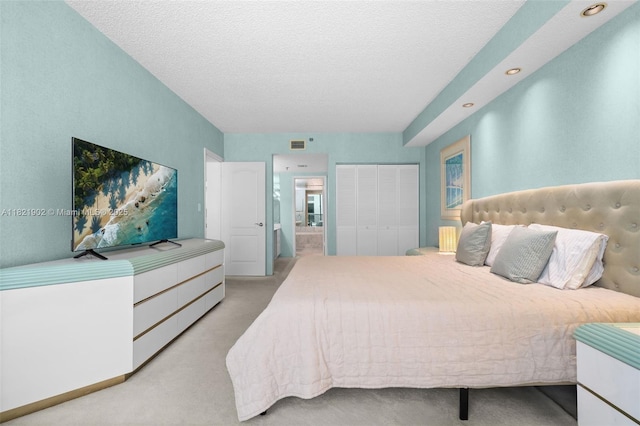9455 Collins Ave Unit 305, Surfside, FL 33154 - bedroom featuring light carpet, a textured ceiling, a closet, and recessed lighting