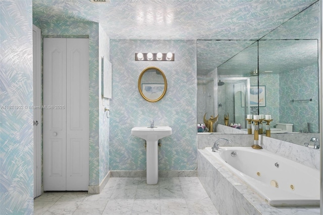 9455 Collins Ave Unit 305, Surfside, FL 33154 - bathroom with a stall shower, a whirlpool tub, a closet, wallpapered walls, and marble finish floors