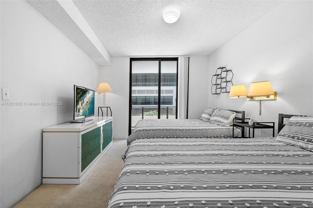 9455 Collins Ave Unit 305, Surfside, FL 33154 - carpeted bedroom with a textured ceiling and a wall of windows