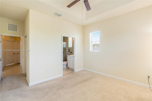 2935 SE 1st Dr Unit 21, Homestead, FL 33033 - unfurnished bedroom featuring light carpet and ensuite bathroom