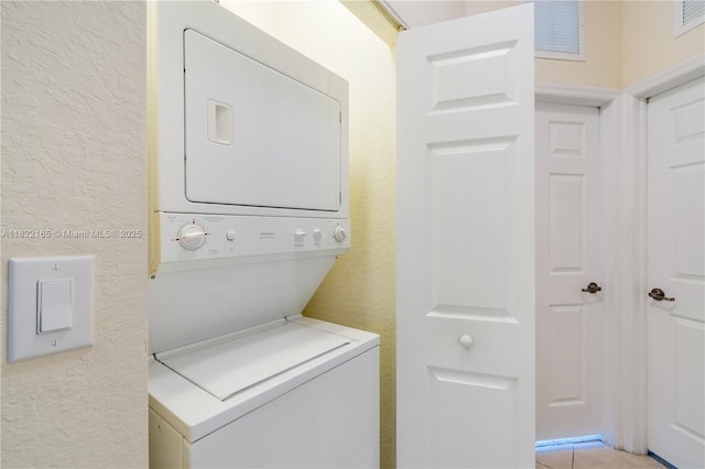 2935 SE 1st Dr Unit 21, Homestead, FL 33033 - washroom with stacked washing machine and dryer and a textured wall