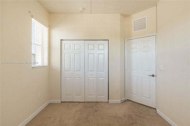 2935 SE 1st Dr Unit 21, Homestead, FL 33033 - unfurnished bedroom featuring light colored carpet and a closet