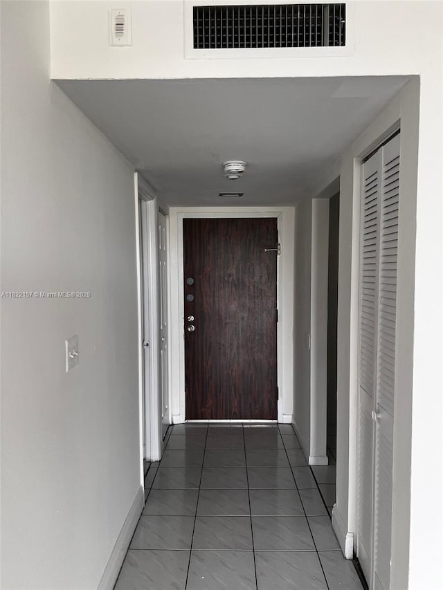 498 NW 165th St Rd Unit D303, Miami, FL 33169 - hallway featuring baseboards
