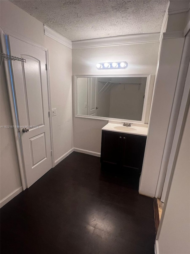 498 NW 165th St Rd Unit D303, Miami, FL 33169 - bathroom with a textured ceiling and vanity