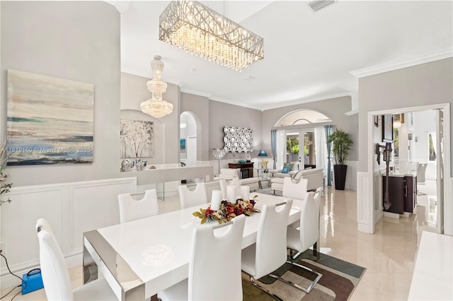 16601 SW 87th Ct, Palmetto Bay, FL 33157 - dining area with ornamental molding, arched walkways, light tile patterned flooring, and a chandelier