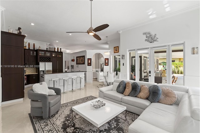 16601 SW 87th Ct, Palmetto Bay, FL 33157 - living area with ornamental molding, arched walkways, a ceiling fan, light tile patterned flooring, and recessed lighting