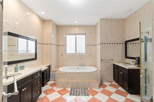 16601 SW 87th Ct, Palmetto Bay, FL 33157 - bathroom featuring tile walls, a garden tub, and two vanities