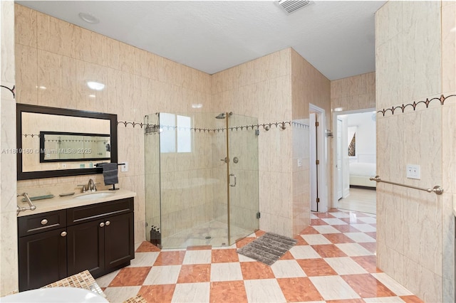 16601 SW 87th Ct, Palmetto Bay, FL 33157 - bathroom with tile walls, vanity, and a shower stall