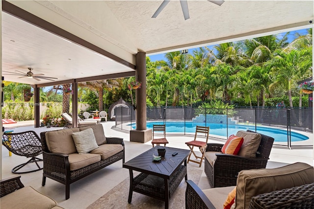 16601 SW 87th Ct, Palmetto Bay, FL 33157 - fenced backyard with ceiling fan, an outdoor hangout area, and a patio