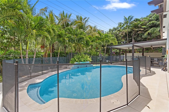16601 SW 87th Ct, Palmetto Bay, FL 33157 - view of swimming pool with a patio area and view of wooded area