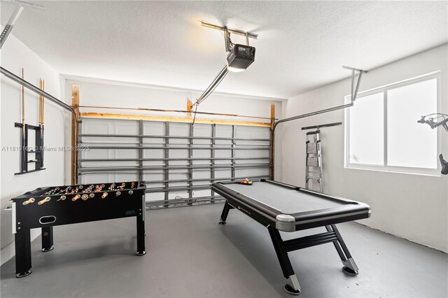 16601 SW 87th Ct, Palmetto Bay, FL 33157 - game room with a garage, concrete flooring, a textured ceiling, and billiards table