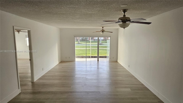 608 NE 2nd St Unit 133, Dania Beach, FL 33004 - empty room featuring ceiling fan, a textured ceiling, and wood finished floors