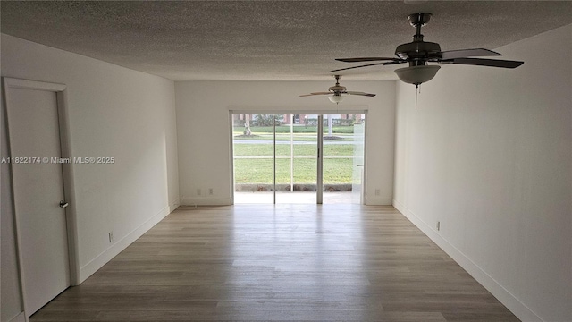 608 NE 2nd St Unit 133, Dania Beach, FL 33004 - spare room with wood finished floors, ceiling fan, and a textured ceiling