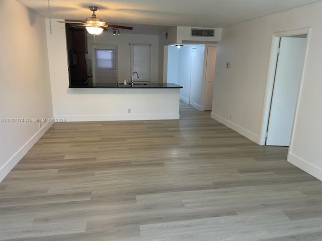 608 NE 2nd St Unit 133, Dania Beach, FL 33004 - unfurnished living room featuring ceiling fan and wood finished floors