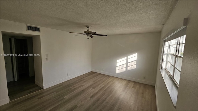 608 NE 2nd St Unit 133, Dania Beach, FL 33004 - unfurnished room featuring wood finished floors, a textured ceiling, and ceiling fan