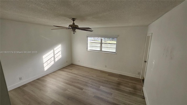 608 NE 2nd St Unit 133, Dania Beach, FL 33004 - unfurnished room with wood finished floors, a textured ceiling, and a ceiling fan