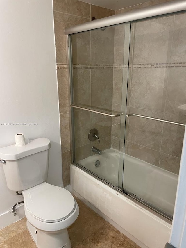 608 NE 2nd St Unit 133, Dania Beach, FL 33004 - full bathroom featuring enclosed tub / shower combo and tile patterned floors