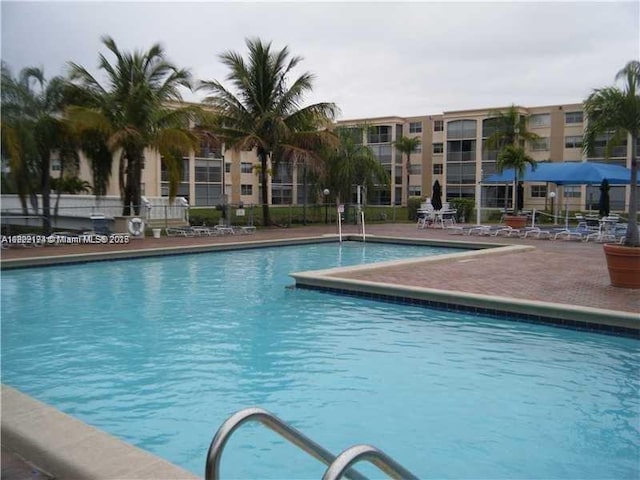 608 NE 2nd St Unit 133, Dania Beach, FL 33004 - community pool featuring a patio area