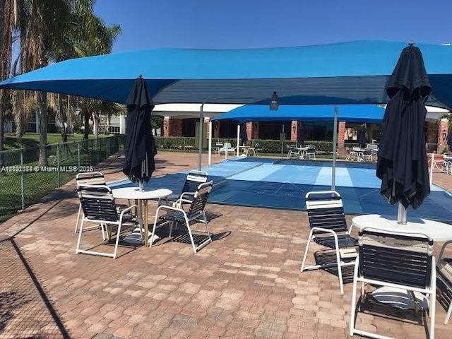 608 NE 2nd St Unit 133, Dania Beach, FL 33004 - community pool featuring a patio area