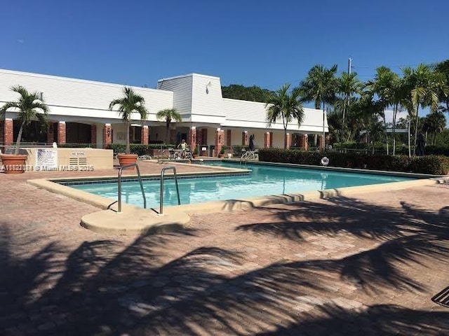608 NE 2nd St Unit 133, Dania Beach, FL 33004 - community pool featuring a patio area