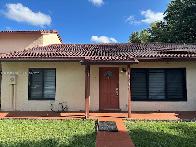 14944 SW 88th Ter, Miami, FL 33196 - view of front of house featuring stucco siding and a tile roof