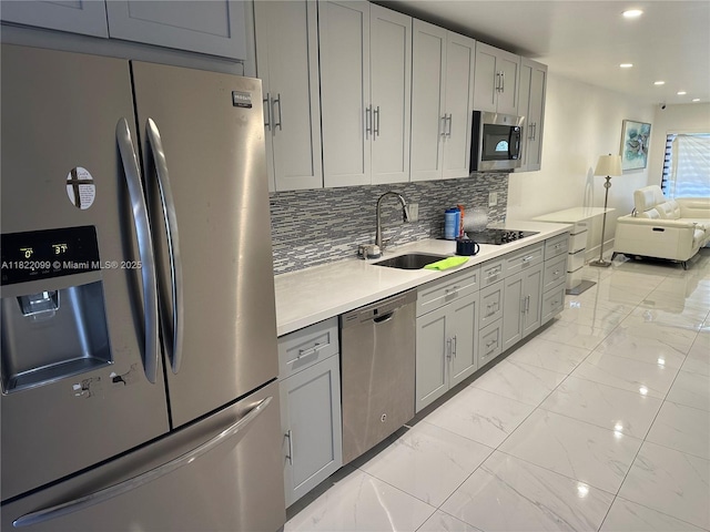 14944 SW 88th Ter, Miami, FL 33196 - kitchen featuring appliances with stainless steel finishes, light marble finish floors, recessed lighting, light countertops, and open floor plan