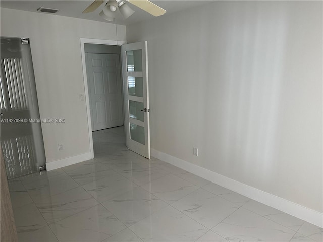 14944 SW 88th Ter, Miami, FL 33196 - empty room featuring marble finish floors and a ceiling fan