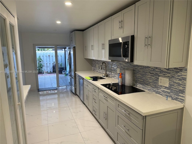 14944 SW 88th Ter, Miami, FL 33196 - kitchen with appliances with stainless steel finishes, light marble finish flooring, decorative backsplash, light countertops, and recessed lighting