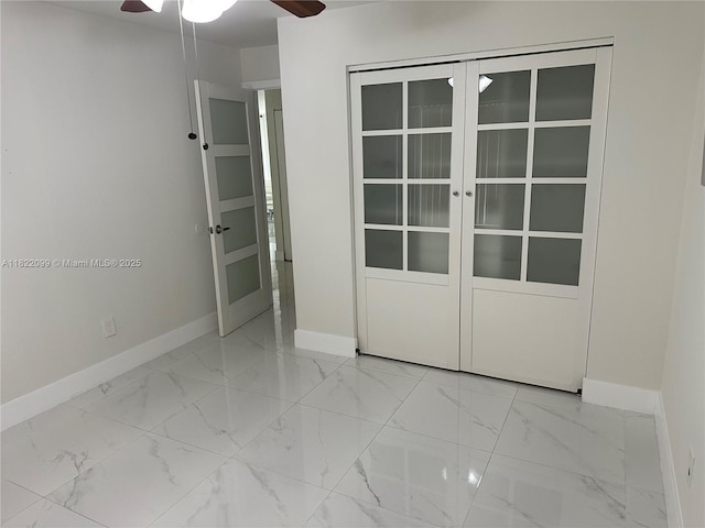 14944 SW 88th Ter, Miami, FL 33196 - unfurnished bedroom with marble finish flooring and a ceiling fan