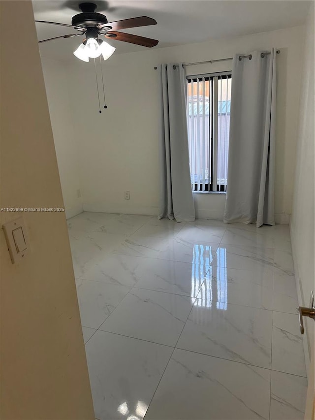 14944 SW 88th Ter, Miami, FL 33196 - unfurnished room featuring marble look tile flooring and ceiling fan