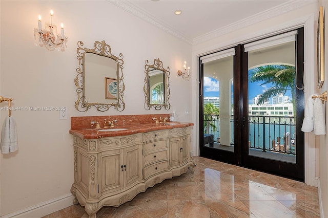 6535 Allison Rd, Miami Beach, FL 33141 - bathroom with double vanity, marble tiled flooring, ornamental molding, a chandelier, and french doors