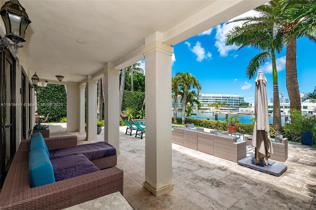 6535 Allison Rd, Miami Beach, FL 33141 - view of patio featuring an outdoor living space and a water view