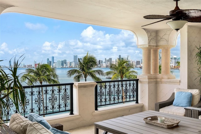 5233 Fisher Island Dr Unit 5233, Miami Beach, FL 33109 - balcony with a skyline view, ceiling fan, a water view, and outdoor lounge area