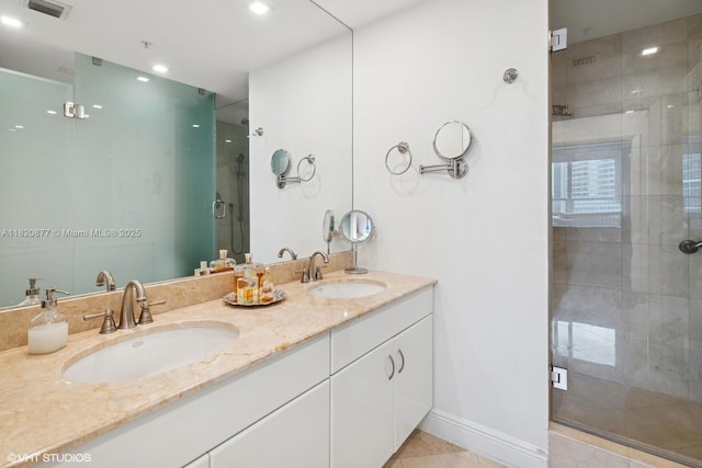 801 Brickell Key Blvd Unit 2202, Miami, FL 33131 - full bath with a shower stall, double vanity, tile patterned flooring, and recessed lighting