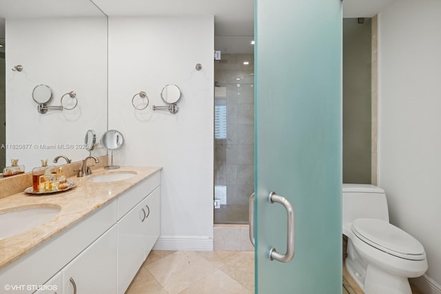 801 Brickell Key Blvd Unit 2202, Miami, FL 33131 - bathroom featuring double vanity, a stall shower, and tile patterned flooring